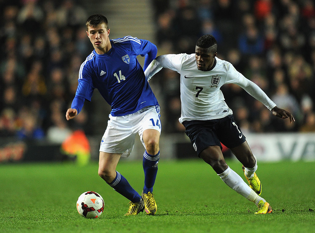 MILTON KEYNES, ENGLAND - NOVEMBER 14: Wilfried Zaha of England Daniel O'shaughnessy of Finland challenge for the ball during the 2015 UEFA European Under 21 Championships Qualifier Group 1 match between England and Finland at StadiumMK on November 14, 2013 in Milton Keynes, England. (Photo by Shaun Botterill/Getty Images)
